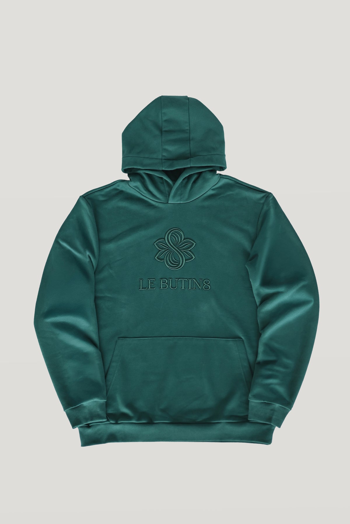 Green Le Butin8 Gratitude hoodie, front flat lay with the embroidered Le Butin8 logo